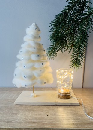 A table nightstand with a Christmas tree for a children's room