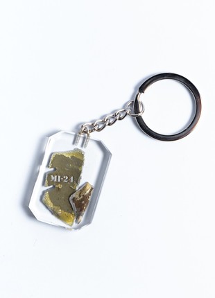 A keyring with a piece of a downed Russian Mi-243 photo