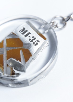A keyring with the wreckage of a downed Russian Mi-35 helicopter