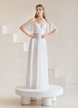 Elegant white airy floor-length dress made of shimmering fabric