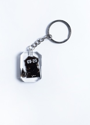 A keychain with a piece of taken down russian su-25 aircraft2 photo