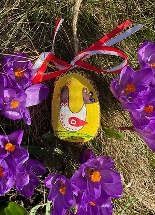 Small yellow easter egg with a bird