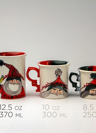 Christmas handmade ceramic mug Santa with a gingerbread man New Year 20233 photo
