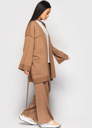 The suit with a cardigan and loose trousers is light brown5 photo