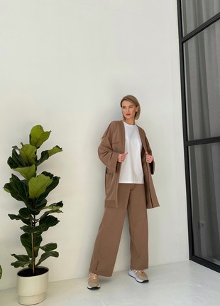 The suit with a cardigan and loose trousers is light brown2 photo