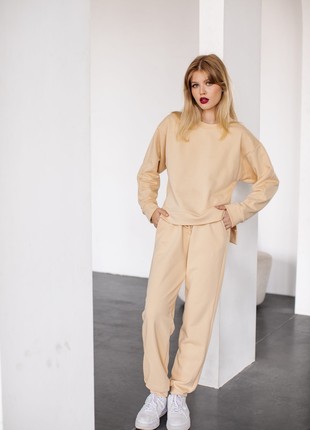 Set of sweatshirt with slits and pants with cuffs on ties Sand