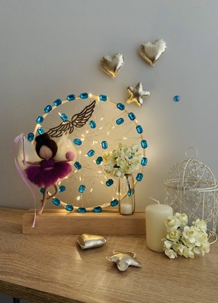 Lantern with a lilac angel and yellow flowers, home decoration, room lighting