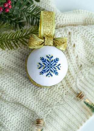 Christmas ball with Ukrainian ornament in blue-yellow color1 photo