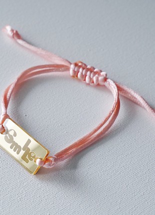 Bracelet "SMILE" by ARNO on a silk cord