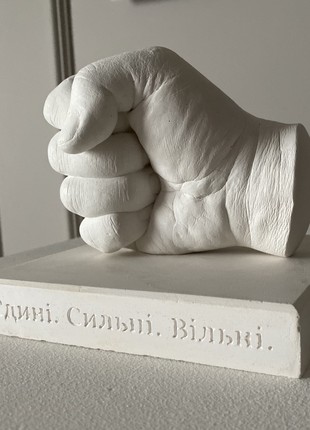 Plaster sculpture of a fist1 photo