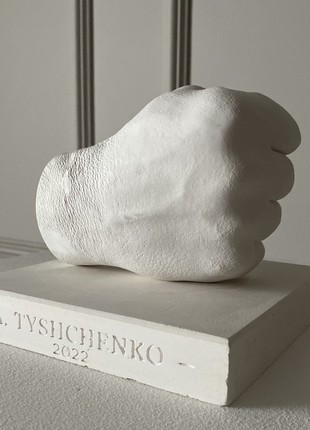 Plaster sculpture of a fist4 photo