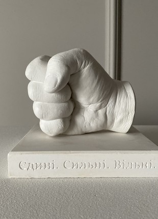 Plaster sculpture of a fist2 photo