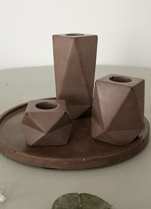 Set of concrete candle holders brown