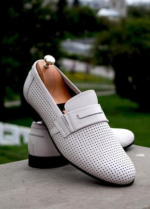 Men's loafers of milk color with perforation. men's summer shoes.