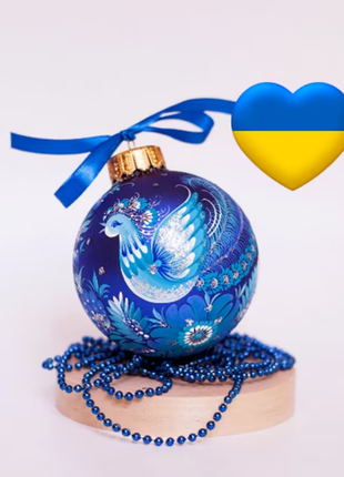 Hand painted Christmas ornament with peacock design in Ukrainian folk style