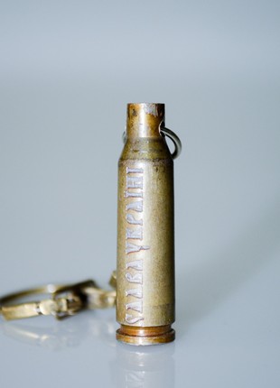 The keychain is made from a spent combat cartridge case "Glory to Ukraine"