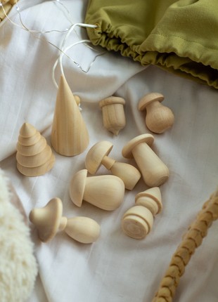 A set of wooden toys in a linen bag