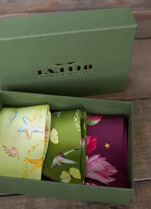 Gift box of three silk skinny scarves.