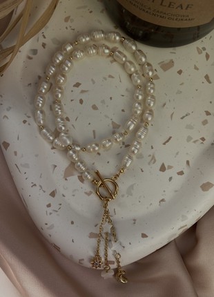 Necklace made of pearls and moon and star pendants