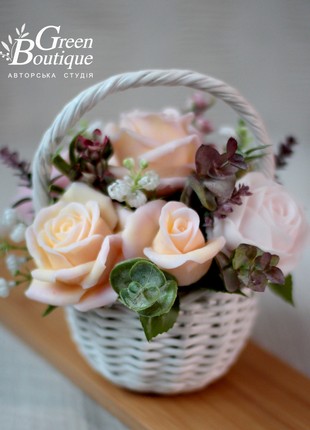 A cute interior bouquet of soap roses in a wicker basket