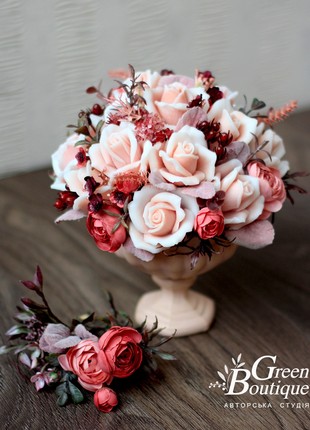 An exquisite interior bouquet of soap roses in a ceramic cup