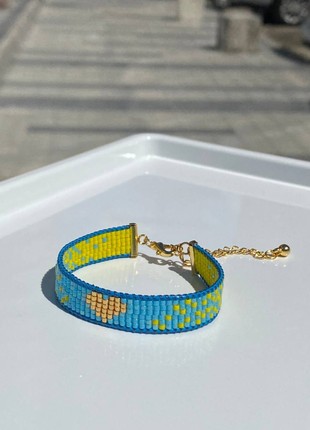 Double yellow-blue bracelet with a heart.
