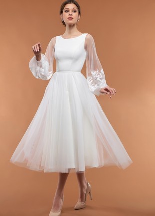 White wedding or cocktail dress with a fluffy tulle skirt