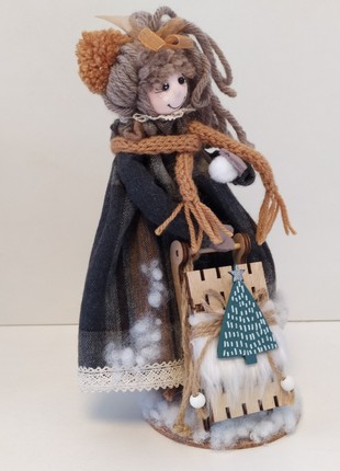 A doll with a sledge