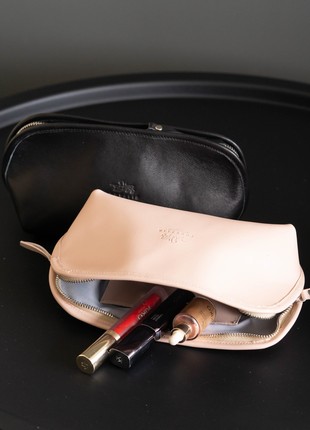 Leather cosmetic bag in black color.1 photo