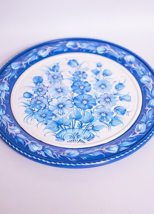 Petrykivka decorative wooden plate with an inflorescence of blue flowers, hand-painted