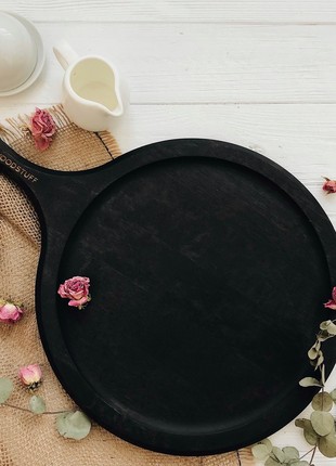 Black wooden serving board with handle, 30 cm3 photo