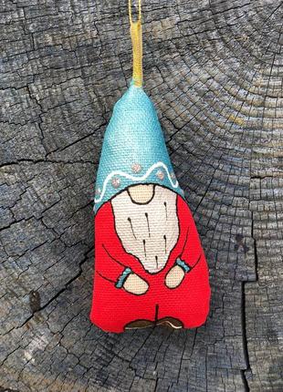 Handmade toy dwarf in a blue hat