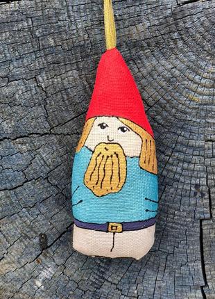 Handmade toy dwarf in a red hat