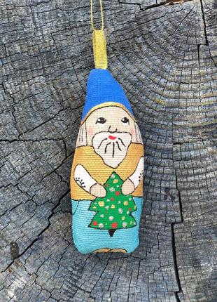 Handmade toy dwarf with a christmas tree