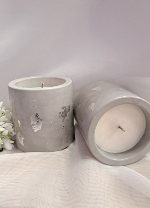 Cylinder candle in a plaster pot