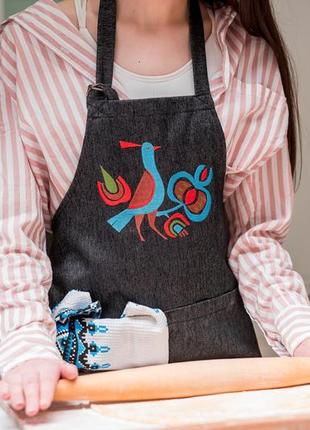 Apron with embroidered bird