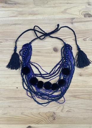 Blue beaded necklace with tassels