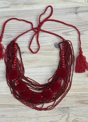 Red beaded necklace with tassels