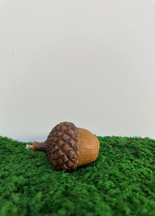 An acorn-shaped wax candle