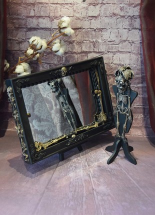 Gothic style dressing mirror with mannequin.
