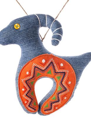 Denim goat with an orange embroidered horseshoe1 photo