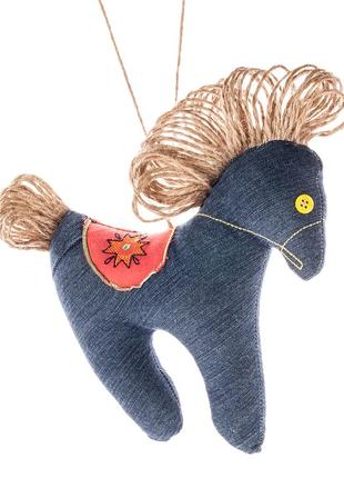 Denim horse with an embroidered saddle1 photo