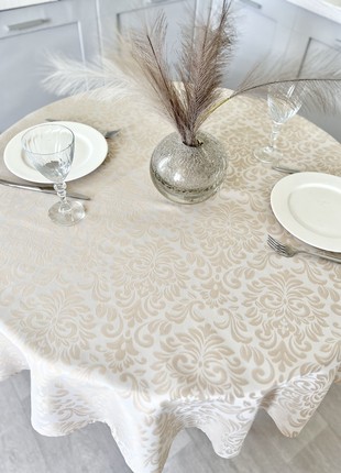 Teflon coated tablecloth ø138 cm. (54 in.) for a round table5 photo