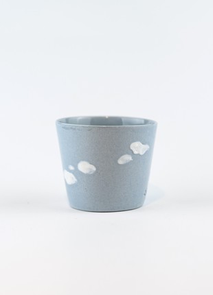 Ceramic cup with cloudy sky