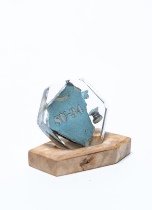 Table mini figurine with a piece of taken down russian su-34 fighter jet. The price is a donation
