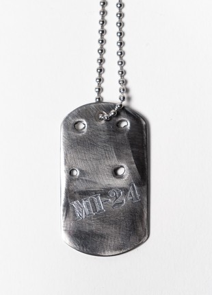Dog tag from the wreckage of a downed Russian Mi-24 attack helicopter. The price is a donation