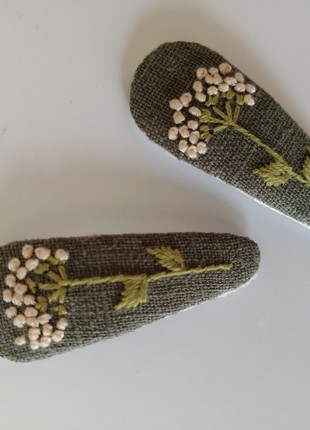 A pair of handmade hair clips