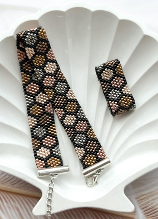 Set of black beads with multi-colored honeycombs
