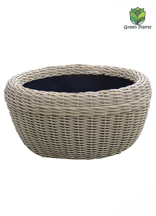 A large pot of 60 l for flowers and plants, a pot made of artificial rattan, handmade.