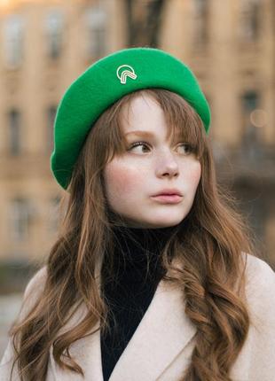 Green woolen beret with gold decor1 photo